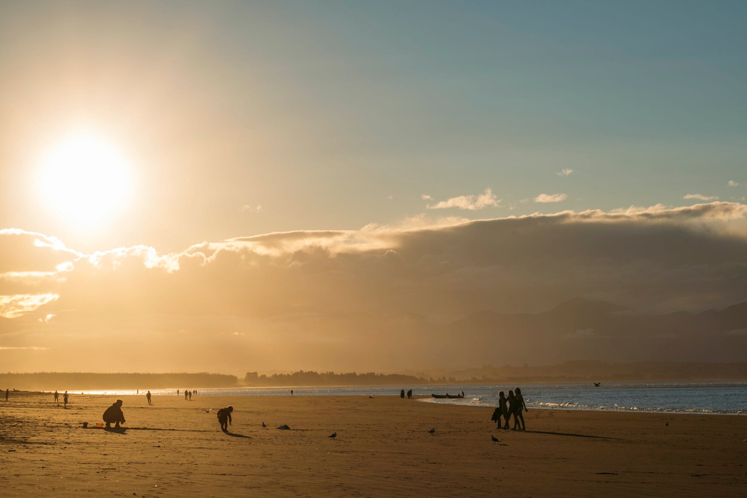191185 sunset on tahunanui beach kids playing web 2560px