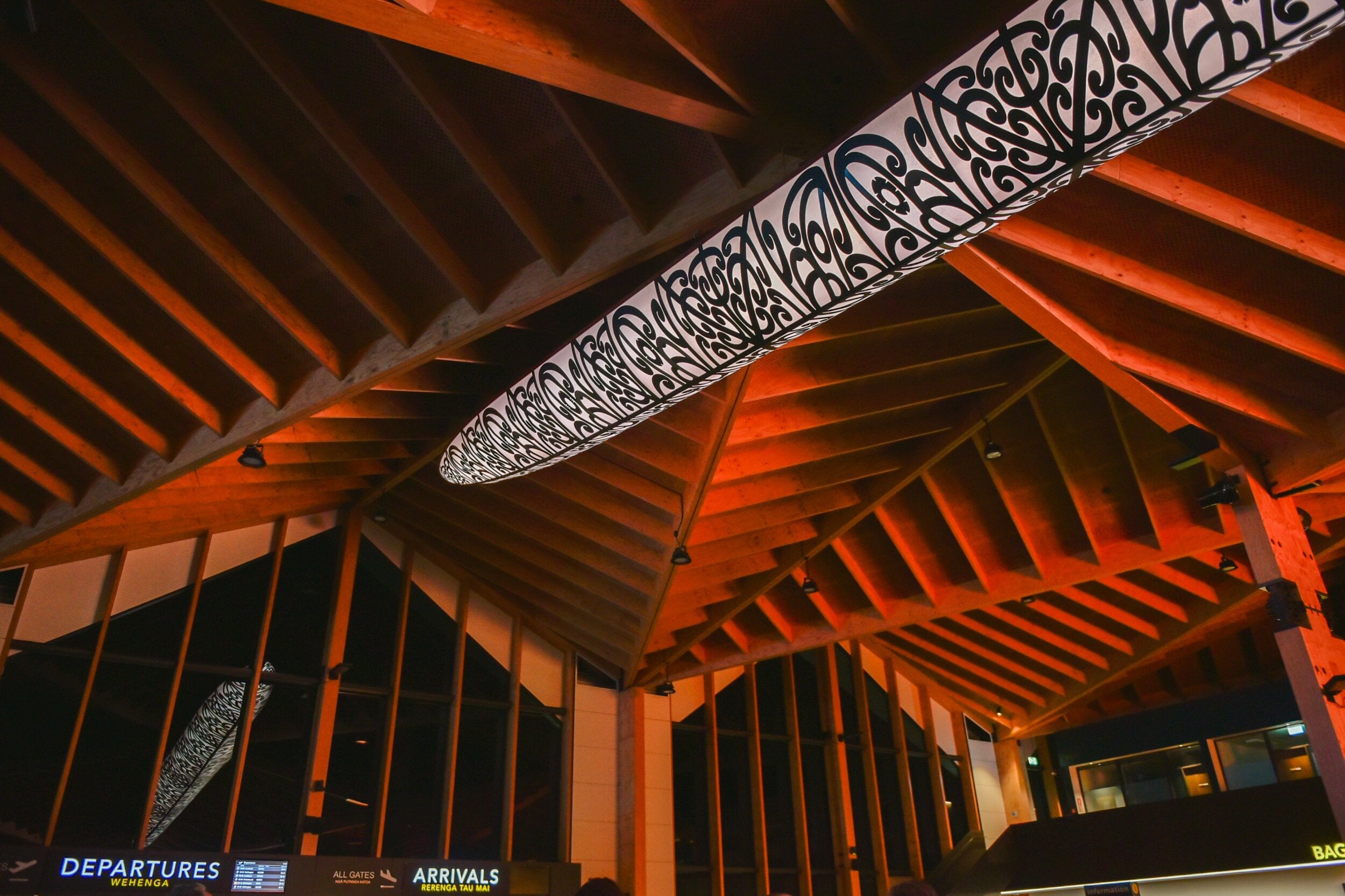 Illuminated waka Aorere Ararau suspended over the airport terminal